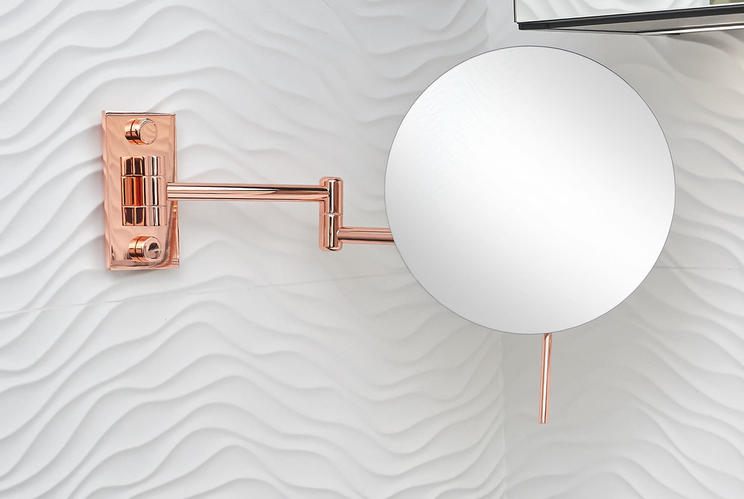 Shown in Polished Copper, the Epure wall-mounted Makeup Mirror has a full 9" diameter mirror - rimless.  It''s simple and elegant.