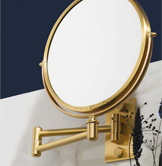 The Patromoine wall-mounted makeup mirror by Miroir Brot iin Matte Gold