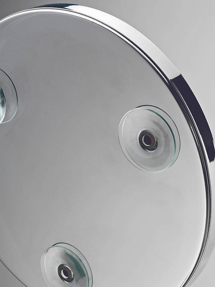 Three strong suction cups on each Decor Walther suction-cup mirror.